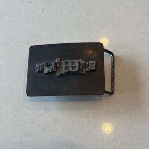 STS belt buckle vintage well made typewriter or some form of printer press keys.